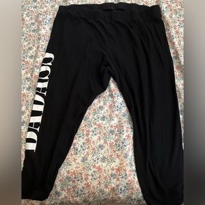 Black leggings from torrid. It says “badass” on the side. Size 5